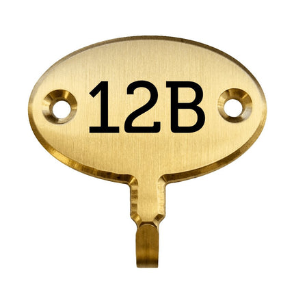 Crochet pour clé gravé ovale en laiton - 35 x 22 mm - par pièce