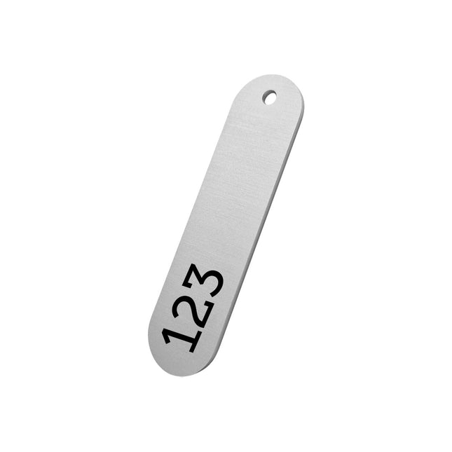 Jeton numéroté argentée en aluminium anodisé ovale - 78 x 28 mm - par pièce