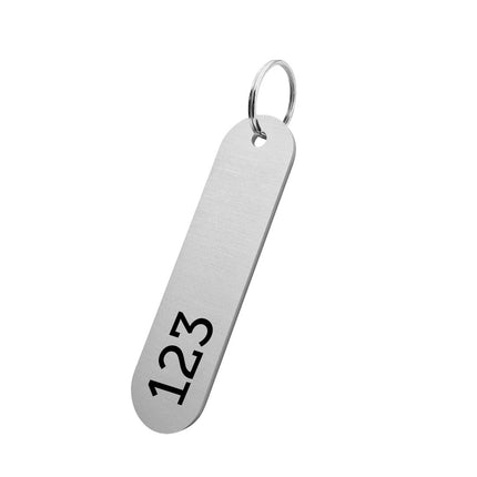 Porte-clés argenté numéroté en aluminium anodisé ovale - 78 x 20 mm - par pièce