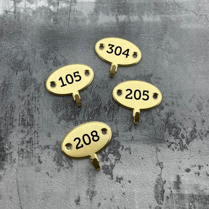 Crochet pour clé gravé ovale en laiton - 35 x 22 mm - par pièce