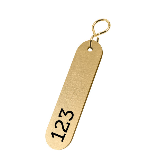 Porte-clés numéroté en laiton ovale - 72 x 28 mm - par pièce